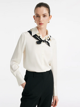 a lady in a cream mulberry silk shirt with silk scarf
